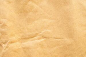 Abstract crumpled and creased recycle brown paper texture background photo