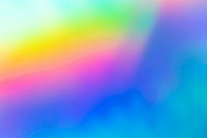 Abstract blur holographic rainbow foil iridescent background photo