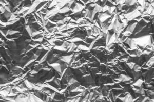 Shiny metal silver gray foil crumpled texture background photo