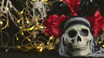 skull with red flowers and a black background video