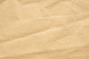 Abstract crumpled and creased recycle brown paper texture background photo