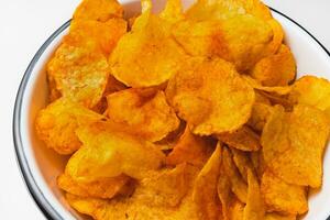 Smoked paprika potato chips in a bowl photo