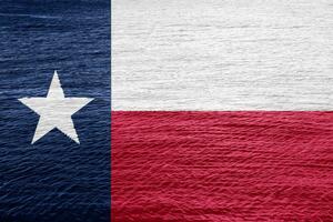 Texas US state flag on textured background. Conceptual collage. photo