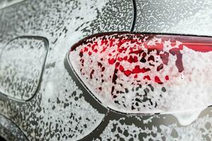 car cleaning and washing with foam soap photo