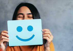 Woman holding blue paper cut happy smile face, positive, customer review, Compliment Day, mental health assessment,Compliment Day, world mental health day concept, satisfaction concept, AI Generative photo