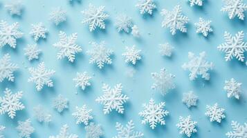 white snowflakes on light blue background photo