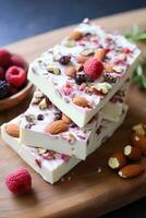 Delicious dessert yogurt bark on a wooden board photo