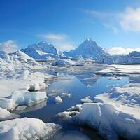 Snowy mountains reflected in calm water around ice floe photo