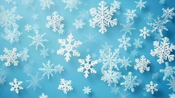 white snowflakes on light blue background photo