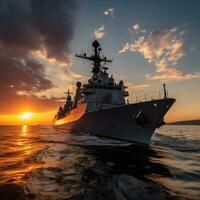 Sunset over a navy ship on the open sea photo