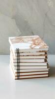 white and square notebook on a marble background photo