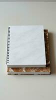 white and square notebook on a marble background photo