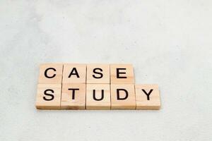 Top view of Case Study word on wooden cube letter block on white background. Business concept photo