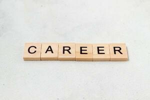 Top view of Career word on wooden cube letter block on white background. Business concept photo