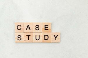 Top view of Case Study word on wooden cube letter block on white background. Business concept photo