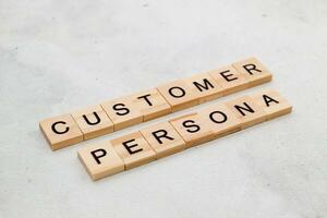 Top view of Customer Persona word on wooden cube letter block on white background. Business concept photo