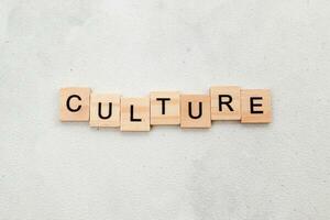 Top view of Culture word on wooden cube letter block on white background. Business concept photo