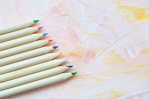 Multicolored wooden pencils on pink background. Drawing, creative arts or back to school concept, copy space photo