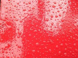 water drops on red background  for backdrop design photo