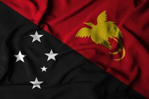 selective focus of island of new guinea flag, with waving fabric texture. 3d illustration photo