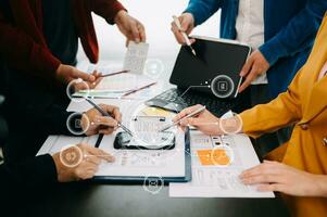 Close up view of UI developer team brainstorming on their project with laptop, smartphone and digital tablet. Creative digital development agency. with virtual icon photo