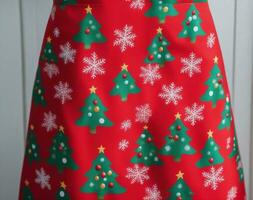 Christmas Themed Aprons Festive Patterns in Vibrant Colors. AI Generated. photo