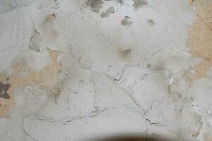 Cracked and abstract grunge texture. Aged material surface backdrop. Weathered effect pattern. Old and dirty background. photo