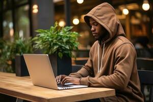 Side view African American people wear hood use laptop on table in coffee cafe. Generative AI photo