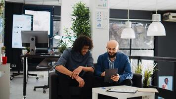 Manager explaining research project, trying to create small business presentation for investment request in coworking space. Startup team collaborating on successful development ideas. photo