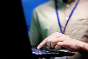 Close up of specialist in high tech facility providing secure, scalable, and reliable infrastructure for storing, processing, and analyzing large datasets generated by artificial intelligence photo