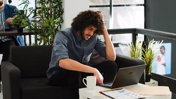 Worker thinking about startup project development, planning new strategy to increase profit. Focused pensive entrepreneur solving software issue, brainstorming reseearch ideas. photo