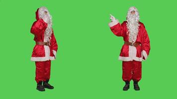 Saint nick character expressing rejection and refusal, showing no symbol on camera. Santa feeling displeased and disappointed, doing disagreement and disappointment sign on greenscreen. photo