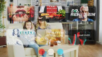 Mother and daughter watching TV using AR projector display, relaxing at home on cozy sofa while enjoying snacks and beverages. Smiling family scrolling through streaming services movies photo