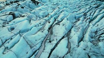 Icelandic frozen lake with ice blocks creating beautiful nordic scenery, vatnajokull glacier cap in iceland. Majestic diamond icy rocks floating on frosty waters, ice landscape. Slow motion. photo