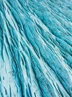 Drone shot of polar icebergs with gorgeous blue ice blocks within icelandic landscape, covered in frost. Fantastic arctic scenery of vatnajokull glacier in iceland, glacier lagoon. photo