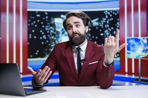 Man journalist presenting breaking news live on television program, working in global communications industry. Media presenter doing news report on daily events and occurences. photo