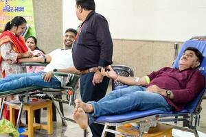 Delhi, India, June 19 2023 - Blood donor at Blood donation camp held at Balaji Temple, Vivek Vihar, Delhi, India, Image for World blood donor day on June 14 every year, Blood Donation Camp at Temple photo