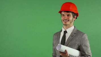 Cheerful handsome engineer holding copy space on his hand video