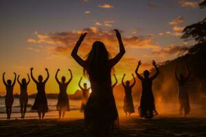 Yogis greeting New Years dawn with sun salutations on tropical sands photo