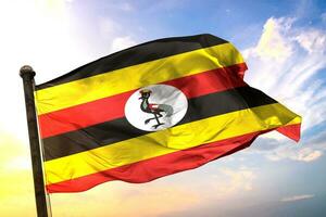 Uganda. 3D rendering flag waving isolated sky and cloud background photo