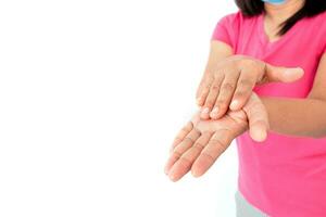 During the coronavirus COVID19 epidemic, A woman washing her hands with alcohol gel isolated on white background photo