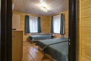 interior of wooden eco bedroom in studio apartments,  hostel or homestead photo