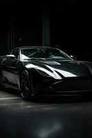 A luxurious, black sports car with a sleek design photo