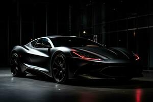 A luxurious, black sports car with a sleek design photo