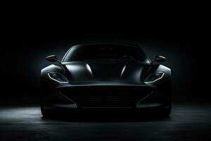 A luxurious, black sports car with a sleek design photo