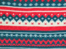 christmas knitted pattern with red and blue snowflakes photo