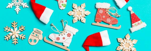 Top view Banner of Christmas decorations and Santa hats on blue background. Happy holiday concept photo