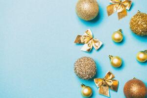 Top view of festive winter composition on colorful background with empty space for your design. Christmas baubles and decorations. New Year concept photo