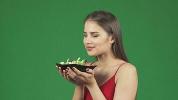 Gorgeous happy healthy woman smelling delicious salad smiling joyfully video