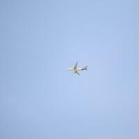 New Delhi, India, April 16 2023 - Vistara Airbus A320 neo take off from Indra Gandhi International Airport Delhi, Vistara domestic aeroplane flying in the blue sky during day time photo